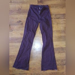 Fashion Nova Women's size 9 Burgundy flare cut with distressed hem